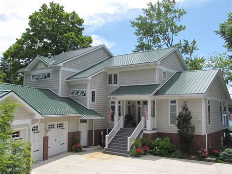 white houses with green metal roofs|matching paint to green roof.